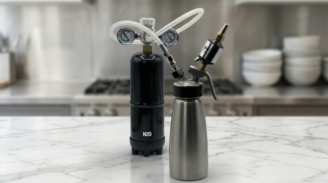 Whippiphany Deluxe 2.0 N2O regulator and filter connected to a whipped cream dispenser on a marble kitchen counter